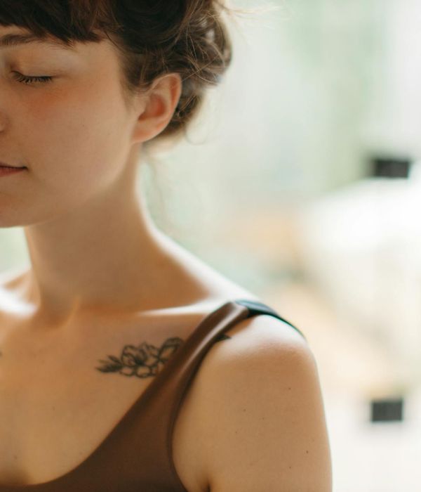 A peaceful woman with eyes closed enjoying inner balance and relaxation width 600 height 700